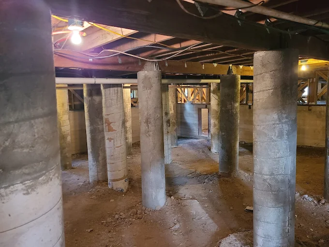 Tall concrete piers installed beneath a home