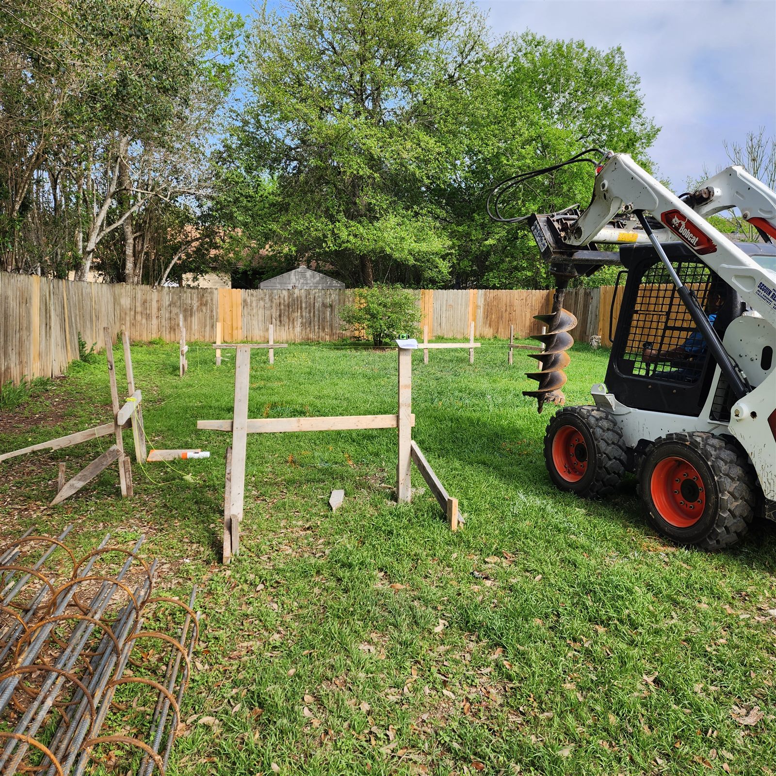 Before: a staked-out yard ready for piers