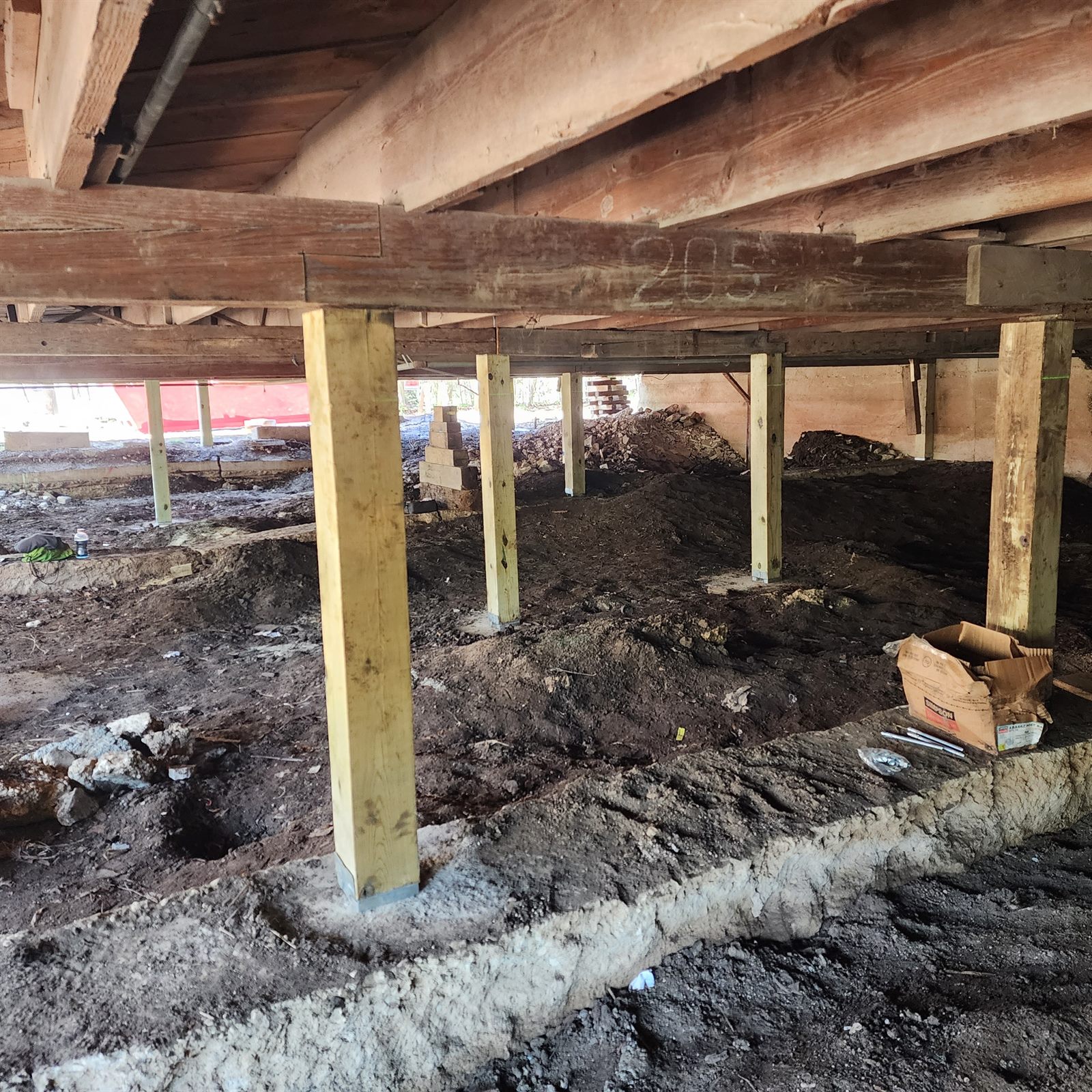 New support piers installed under a pier-and-beam home in Central Texas